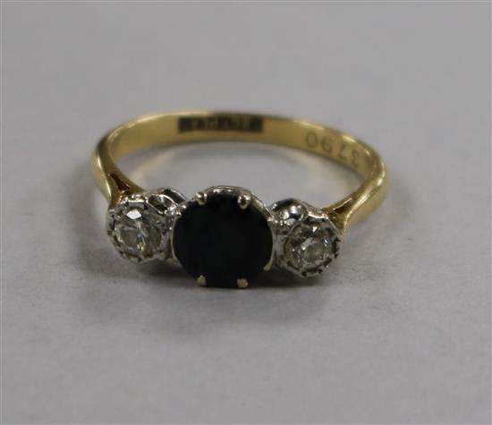 A sapphire and diamond three-stone ring,